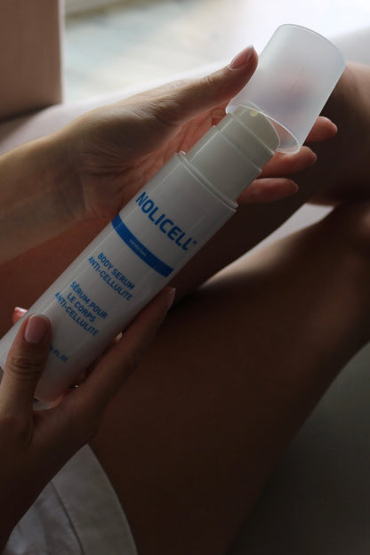 Serum Nolicell na cellulit - butelka w dłoni